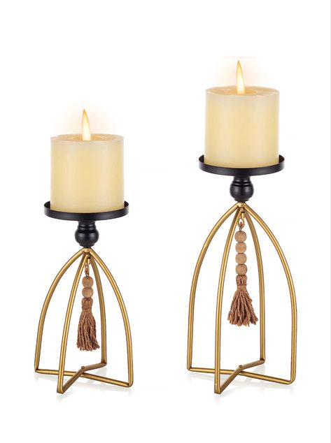 Pillar candle holder set in black matal with wooden bead tassles and gold leg stands. Modern Farmhouse/Famhouse themed home decor accents. Perfect for table centerpiece, fire place mantels, or accent for hutch or dresser. Candle Stand Ideas, Boho Candle Holders, Modern And Vintage Decor, Rustic Table Centerpieces, Living Room Mantle, Boho Candle, Metal Farmhouse, Pvc Pipe Crafts, Beaded Candle