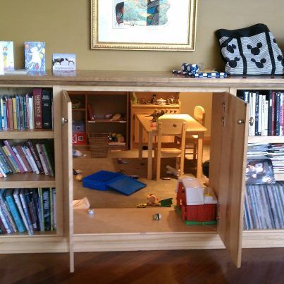 secret playroom through cabinet doors in bookshelf? It could be made into a safe room by simply making a false door look like part of the bookcase. You could build a fantasy tent like in the movie "The Holiday" for girls. Hidden Playroom, Creative Bookshelves, Hidden Spaces, Secret Room, Safe Room, Hidden Rooms, Secret Door, Room Deco, Secret Rooms