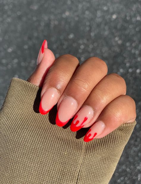 Elevate your Halloween look with these chic oval acrylic nails featuring a spooky twist on the classic French tip. The blood-red drip design adds a haunting touch to a neutral base, perfect for Halloween parties or a subtle nod to the season. Easy to recreate and sure to turn heads, these nails combine elegance with eerie vibes. #HalloweenNails #OvalAcrylics #RedDripNails #SpookyManicure #nailartideas Drip French Tip Nails, French Tip Nails Oval, Nails Oval Acrylic, Blood Drip Nails, Classic French Tip, Red Drip, Oval Acrylic Nails, Acrylic Manicure, Nails Oval