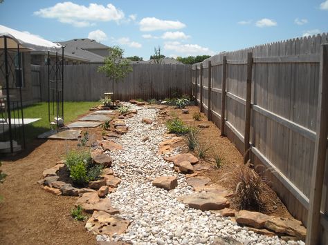 dry creek bed along fence Desert River, Flagstone Pathway, Dry Creek Bed, Decomposed Granite, Fountains Backyard, Drought Tolerant Landscape, Landscape Stone, Pond Landscaping, Creek Bed