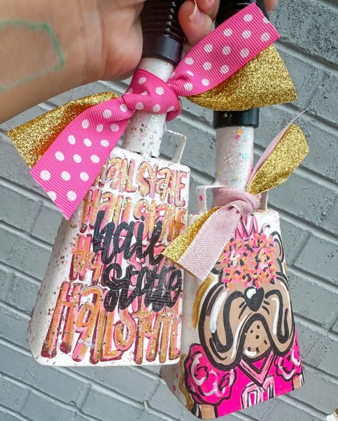 If I had to choose one order to represent my style/brand, it’d 1000% be this one! give me all the brights, neons, glitter, stars - if it looks chaotic & a bit too much, add a little more & thennnn we’re talking HG 🤩💖🧡🌟✨ #gamedaybell #gamebells #collegefootball #SEC #footballseason #footballsaturday #collegegirls #seniorgifts #smallartist #smallbusiness #localbusiness #localartist #meridianmagazine #etsyshop #etsyseller Mississippi State Cowbell Painted, Painted Items To Sell, Cowbell Painting Ideas, School Spirit Items To Sell, Football Game Student Section, Painted Cowbell, Painted Banner Ideas, Shop Small Business Quotes, Paint Games