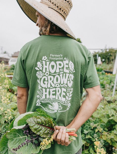 This “Hope Grows Here” t-shirt bears the emblem of a movement striving for developmental change – a community working towards a shared goal, each thread woven into its fabric represents solidarity and collective action. As it adorns the shoulders of wearers from diverse backgrounds and walks of life, this simple t-shirt serves as a visual reminder of our interconnectedness. It has been made, of course, using regenerative certified organic farming methods so you can actually wear the values of its message.   100% of proceeds of the sale of this shirt will go to supporting the work of Farmer’s Footprint organization by Dr. Zach Bush to help bring regenerative farming to more people and places! Regenerative Farming, Resort Swimwear, Symbol Of Hope, Merch Ideas, Simple T Shirt, The Farmer, Simple Tshirt, Activewear Fashion, Organic Linens