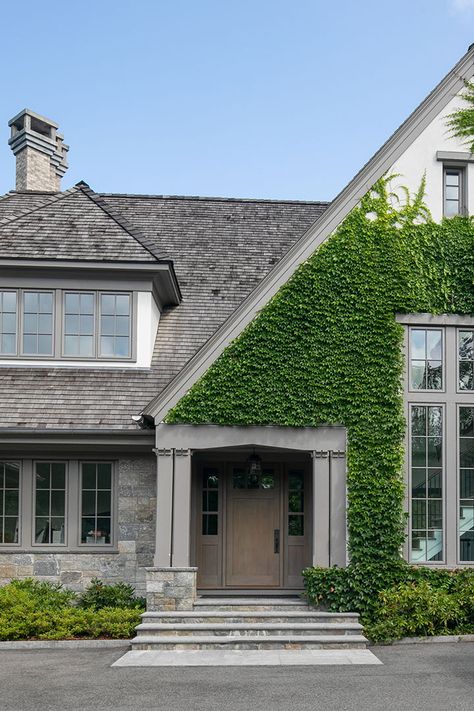 Tour a Modern Tudor-Style Home Designed with Stone in Mind - Cottages & Gardens Stone Landscape, Curb Appeal Landscape, Granite Fireplace, Exterior Facade, Masonry Work, Tudor Style Homes, Stone Architecture, Landscaping Supplies, Tudor Style