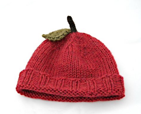 "Handknit in a soft and cozy 100% wool, a rich harvest red with beautiful variegated tones. The folded brim is long enough to cover ears and keep them warm. The stem top is a dark walnut brown with a felted earthy taupe leaf. Note: Green apples are currently sold out but will be back in stock soon Approximate Circumference (unstretched) Newborn: 13.5\" (34 cm) Baby 0-6 months: 15\" (38 cm) Baby 6-12 months: 16.5\" (42 cm) Toddler 1-3 years: 18\" (46 cm) Kids Small 4-8 years: 19.5\" (49.5 cm) Kid Fall Hat Crochet, Crochet Apple Hat, Crochet Fruit Hat, No Sew Gifts, Knitted Christmas Gifts, Autumn Items, Granny Square Hat, Felted Accessories, Knitting Easy