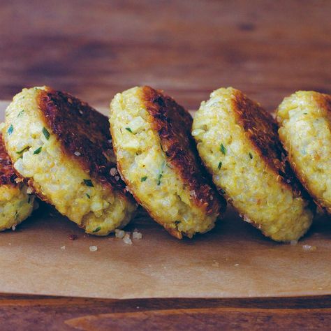 Anytime I have leftover cooked quinoa, I make these little patties. They're good hot or cold and are well suited to fighting afternoon hunger pangs. It's a bit of a stretch, but they could be described as a (very) distant cousin of arancini, Italy's beloved deep-fried risotto balls. In contrast, these are pan-fried in a touch of oil, and smushed flat in the pan to get as much surface browning and crust as possible. I'm including my basic version, but often times I'll add a handful of very finely Vegetarian Patty, Quinoa Patties, Risotto Balls, Healthy Quinoa, Cooked Quinoa, Quinoa Protein, Vegan Recipes Videos, Patties Recipe, Asparagus Recipe