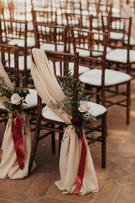 We're Obsessed with Every Inch of This Moroccan Glam Wedding at Rancho Las Lomas | Junebug Weddings Burgundy Wedding Aisle Decorations, How To Dress Up Folding Chairs For A Wedding, Red Aisle Decorations Wedding, Christmas Themed Wedding Ceremony Decor, Crimson And Champagne Wedding, Red Wood Wedding, Red Wedding Inspiration, White Red Wedding Decoration, Christmas Wedding Chair Decorations