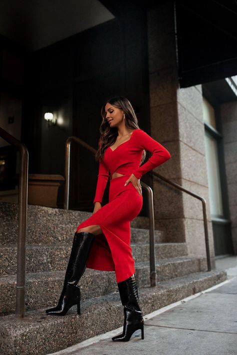 fashion blogger mia mia mine wearing a red matching knit set with knee high boots from express. this is the perfect holiday outfit for parties, dinner dates and more. #datenight #matchingset #falloutfit #style Red Knit Dress Outfit, Red Dinner Outfit, Red Dress Winter Outfit, Red And Black Outfits For Women, Red Dress Black Boots, Red Dress With Boots, Red Outfit Women, Red Knee High Boots Outfit, Red Sweater Dress Outfit