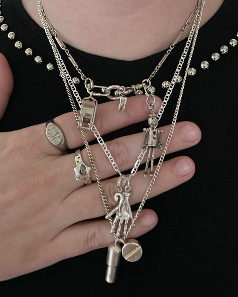 3️⃣ all silver or all gold stack (opposite of what you typically choose) wearing silver for this third day of the styling challenge from @gemfinsta.gram 👽 i would say i typically go for gold, even though i do wear a lot of mixed metals. wearing an all sterling silver stack today ft my great grandpas watch chain, pinocchio, toof, loupe, pills from @14karatdoll , hand, mariner from @thegoldneckmess , and question mark. . . . . . . . . #gold #silver #goldjewelry #goldjewellery #silverjewelry ... Mixed Metal Necklace Layering, Silver And Gold Jewelry Mixing, Silver Necklace Stack, Silver Jewelry Stack, Watch Stack, Necklace Stacks, Eccentric Fashion, Necklace Stack, Chunky Chain Necklaces