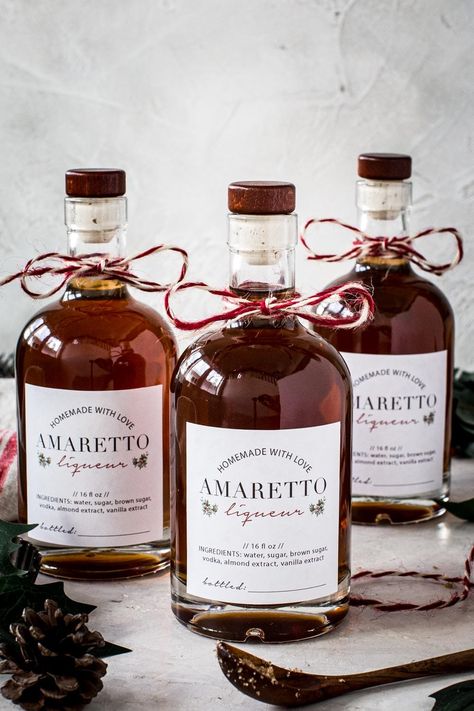 Homemade amaretto bottles with labels and string. Homemade Flavored Liquor, Walnut Liquor Recipe, Homemade Christmas Liquor, Homemade Christmas Gifts Alcohol, Home Made Alcohol Gifts, Homemade Liquor Gifts, Amaretto Recipes Homemade, Homemade Amaretto Liquor, Mead Recipes Homemade