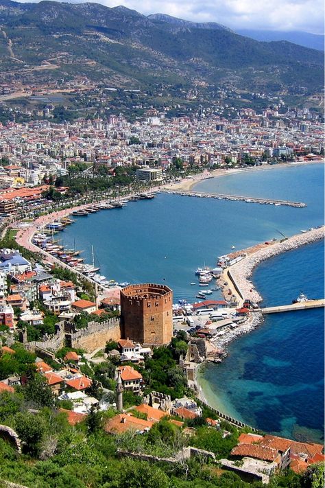 #Alanya, #Turkey is a laid-back city along Turkish Riviera. Its relaxed atmosphere, happy-go-lucky people, and gorgeous weather completely altered my understanding of the country. Turkey Views Beautiful, Turkey Coast, Turkish Riviera, Antalya Turkey Beach, Antalya Turkey Lara Beach, Turkey Coastal Towns, Turkey Vacation, Alanya Turkey, List Ideas