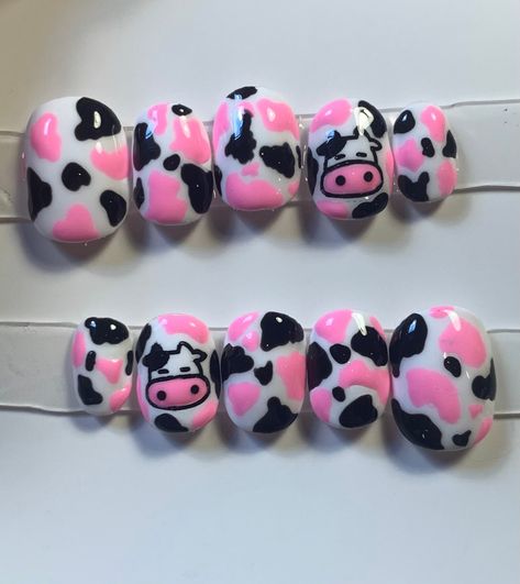 These kid-sized nails have a white base featuring black and pink cow print.  the accent nail has a cute kawaii cow painted on it.  These made to order press on nails are made with soft gel and painted with gel polish. The inside of each nail is etched to ensure the longest possible wear. They are easy to apply, reusable, and can last up to 3 weeks with proper care.  See the measuring guide in the product listing to learn how to properly measure your nails. If your nails don't line up with one of Pink Cow Print Nails, Kawaii Cow, Press On Nail Kit, Nails Application, Pink Cow Print, Kids Nail Designs, Nail Kits, Cow Nails, Special Nails