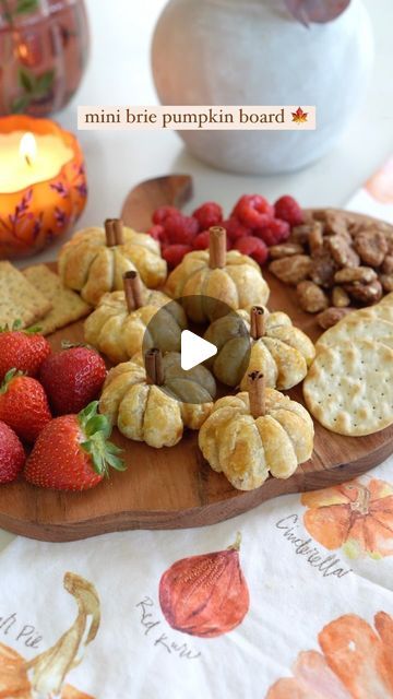 Carol & Ale on Instagram: "Mini Brie Pumpkin Board 🍁🍂 the easiest and most delicious way to celebrate Fall! These brie bites are SO amazing, gooey and lightly sweet, and they look beautiful on a charcuterie board

You just need:
- Puff Pastry
- Mini Bries (or a big brie cut into pieces)
- Pumpkin Butter
- Egg
- Cinnamon Sticks

Cut the puff pastry into 9 equal squares and add a little bit of pumpkin butter to the center of each square. Place the mini brie in the middle and fold the edges to close. Tightly wrap each one with twine to create a pumpkin shape, place on a cookie sheet and brush with egg wash. Bake for 20-25 at 375 degrees, or until golden brown. Remove the twine and add half a cinnamon stick to the center. Serve warm on a charcuterie board with fruits, nuts, and crackers.

Co Pumpkin Shaped Puff Pastry, Mini Brie Pumpkins, Brie Pumpkin, Pumpkin Brie, Brunch Boards, Pumpkin Board, Fall Charcuterie Board, Brie Bites, A Charcuterie Board