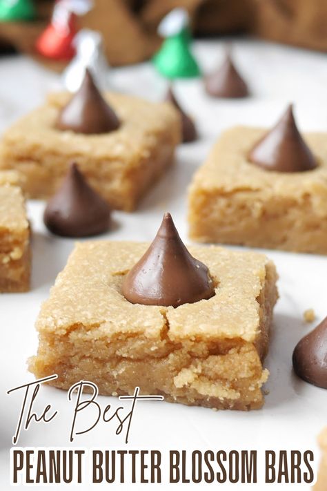 These delicious peanut butter blossom bars are a great way to use up Hershey kisses! Peanut Butter Blossoms Bars, Hershey Kisses Desserts, Peanut Blossom Bars, Hershey Kiss Desserts, Peanut Butter Blossom Bars Recipe, Recipes With Hershey Kisses, Hershey Kiss Recipes, Peanut Butter Blossom Bars, Blossom Bars