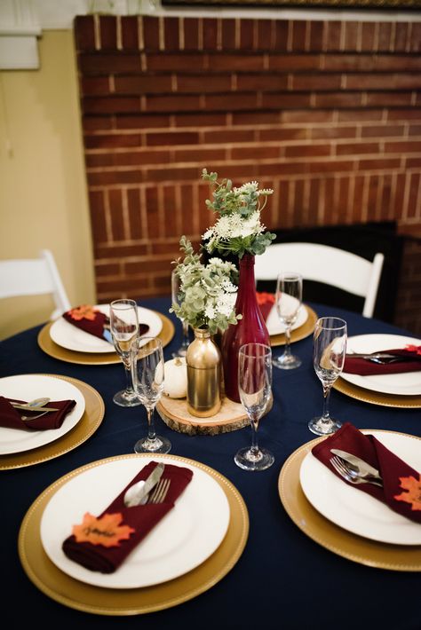 Maroon And Navy Table Setting, Fall Wedding Napkins Place Settings, Fall Wedding Plate Setting, Burgundy And Navy Wedding Centerpieces Wedding Table Decor, Fall Wedding Table Cloth Ideas, Navy Burgundy Gold Wedding Centerpieces, Navy Blue Burgundy Gold Wedding Tables, Burgundy And Navy Wedding Table Setting, Navy Blue And Rust Wedding Table Decor