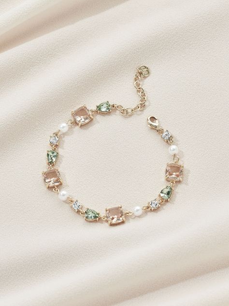 DESCRIPTION Feminine and elegant, this luxe bracelet brings together an elevated pattern of crystals with compliments of gorgeous blush and green tones. The perfect dangling adornment for your wrist. Wear on its own or layer with other dainty bracelets. Get the perfect length: Chain Extender Wear with: Phoebe Bracelet Blue Hair Accessories, Neck Pieces Jewelry, Wrist Wear, Jewelry Accessories Ideas, Popular Jewelry, Fancy Jewellery, Chain Extenders, Demi Fine Jewelry, Dainty Bracelets