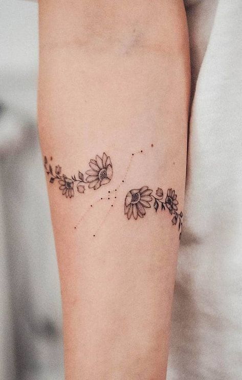 52 Gorgeous Taurus Tattoos with Meaning - Our Mindful Life Taurus Wrist Tattoos For Women, Taurus Wrist Tattoo, Round Arm Tattoo, Taurus Floral Tattoo, Taurus Star Sign Tattoo, Unique Taurus Tattoo Ideas, Taurus Flower Tattoo, Taurus Tattoo For Women, Tattoo Design Arm