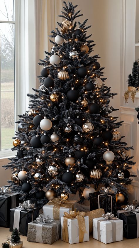 Elegant black and white Christmas tree with silver and gold ornaments, surrounded by gifts in a cozy, well-lit living room. Black Farmhouse Christmas Tree, Black Ornament Christmas Tree, White Glam Christmas Tree, Black Ornaments Christmas Tree, Glam Christmas Tree Ideas, Nature Christmas Tree, Black And Gold Christmas Tree, Black And White Christmas Tree, Bronze Ornaments