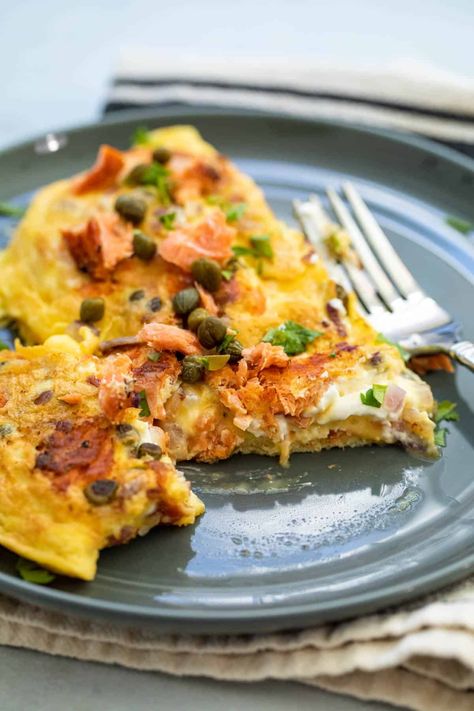 Here is a delicious smoked salmon omelette recipe that makes a quick and tasty breakfast. My version includes capers, red onion, and cream cheese! macheesmo.com #omelette #smokedsalmon Smoked Salmon Omelette Cream Cheeses, Eggs Smoked Salmon Breakfast, Salmon Omelette Recipe, Salmon Omelette Breakfast, Omelettes Recipe, Wednesday Meals, Salmon Omelette, Keto Omelette, Smoked Salmon Omelette