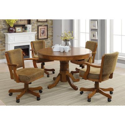 Perfect for an entertainment room or versatile space, this five-piece dining set is all fun and games. Enjoy a morning cup of coffee by day and poker or bumper pool by night with the three-in-one table top. Completely classic, this craftsman-inspired set features a light and warm hue. Including four armchairs and pool sticks and balls, the solid oak construction is relaxed with delicate curves and carvings. Full of plush cushions and casters, the comfortable chairs boast hours of entertainment. Game Table In Living Room, Bumper Pool Table, Game Table And Chairs, Multi Game Table, Bumper Pool, Table With Chairs, Game Chair, Wood Accent Table, Conference Chairs