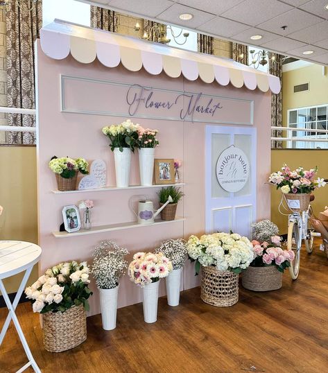 Bonjour Bebe Baby Shower | CatchMyParty.com Garden Theme Balloons, Flower Shop Backdrop, Storefront Backdrop, Paris Tablescape, Baby Shower Flower Bar, Flower Bar Ideas, Paris Theme Party, Bridal Shower Backdrop, Baby In Bloom