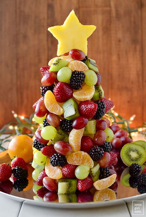 Start a new holiday tradition with a beautiful and fresh Fruit Christmas Tree! Perfect for parties, a dessert table centerpiece, or a healthy treat for Santa. | iowagirleats.com Healthy Christmas Desserts, Healthy Christmas Snacks, Fruit Christmas, Christmas Tree Food, Fruit Christmas Tree, Healthy Christmas Recipes, Iowa Girl Eats, Christmas Fruit, Healthy Christmas