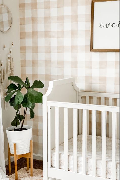 This beautiful wallpaper is 15% off right now! Baby girl nursery | baby girl nursery decor | wallpaper accent wall | neutral girl nursery Brown Accent Wall Nursery, Gingham Nursery Girl, Boy Nursery Wallpaper Accent Wall, Gingham Wallpaper Nursery, Accent Wall Neutral, Nursery Wallpaper Accent Wall, Neutral Girl Nursery, Gingham Nursery, Nursery Decor Wallpaper