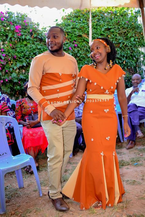 We love having you at our workshop.we will discuss your designs in detail and make your dream come true.contact us 0702376767, stitched on order African Couple Wedding Outfit, Ruracio Outfits For Couples, Couples Attire, African Couple, Couples African Outfits, Kitenge Designs, Shweshwe Dresses, African Print Tops, African Dresses Men