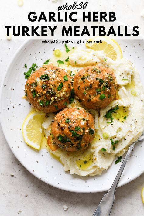 These baked whole30 garlic herb turkey meatballs are a tasty protein rich main dish that are made with ground turkey, fresh herbs, garlic, lemon, and ghee. Perfectly balanced, cooked to perfection, and made without cheese or breadcrumbs. Whole30, paleo, gluten free, low carb + keto friendly. #whole30recipes #turkeymeatballs #glutenfreedairyfree #lowcarb #ketofriendly Whole 30 Turkey, Garlic Herb Turkey, Whole30 Turkey Meatballs, Ground Turkey Meatball Recipes, Garlic Turkey, Turkey Meatballs Recipe, Paleo Turkey, Ground Turkey Meatballs, Gluten Free Turkey