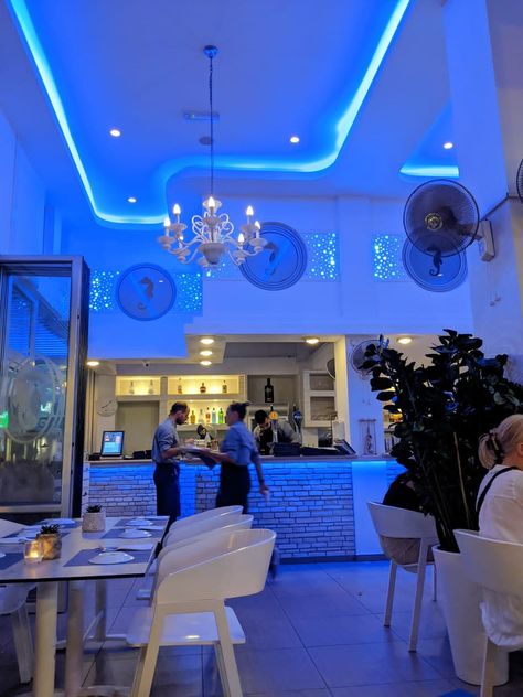 Aesthetic restaurant decorated with blue led lights , blurred motion, server with a tray Light Blue Cafe Aesthetic, Beautiful Blue Aesthetic, Blue Restaurant, Aesthetic Restaurant, Blue Cafe, Summer Eats, White Cafe, White Chairs, Blue Bar