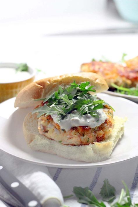 These Salmon Burgers are topped with a Lemon Caper Aioli and are SO easy to make! This recipe is perfect for a healthy alternative to traditional burgers and great for the Lenten season. Salmon Burger Recipe, Lenten Season, Lemon Salmon, Salmon Patties, Healthy Recipies, Unprocessed Food, Dinner Meals, Grilled Salmon, Aioli