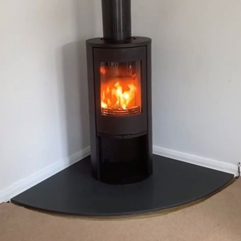 Corner Hearth Ideas, Free Standing Log Burner Living Rooms, Corner Log Burner Ideas, Granite Fireplace Hearth, Stove Hearth Ideas, Corner Wood Burning Stove, Offset Fireplace, Corner Log Burner, Free Standing Stove