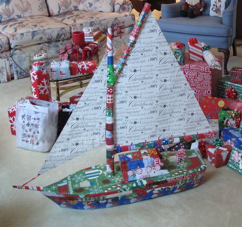 Now that's how to wrap a Christmas present!  (It's not a boat....it's an umbrella disguised as a boat!) Cardboard Sailboat, Prank Gift Boxes, Christmas Present Wrap, Baskets Christmas, Boating Gifts, Wrapping Presents, Christmas Traditions Family, Themed Gift Baskets, Unique Gift Wrapping