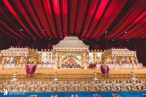 This grand main backdrop isn't just decor; it's the heartbeat of our South Indian wedding celebration. More than just a beautiful setting, the intricate temple theme design, with its golden accents, reflects the love, traditions, and heritage that bring us together. Every detail whispers stories of our ancestors and creates a truly magical ambiance for our special day.✨ Bride & Groom: Soumya & Teja Venue: @anvayaconventions Wedding Design & Execution: @rachnoutsavweddings #rachnoutsav #wedd... October Decor, October Decorations, Wedding Stage Decor, Stage Background, Stage Decor, South Indian Weddings, Decor 2024, South Indian Wedding, Indian Weddings