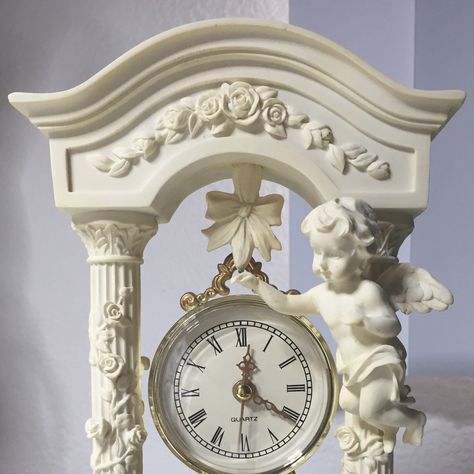 #cupid greek love god  baby angels statues with victorian arches and clock in middle antique piece #vintage #gifts #home #decor #mothersday #sale  #cupido amor deus grego Anjos do bebê estátuas com arcos vitorianos e relógio na peça antiga média#decoração Angel Academia Aesthetic, Angel Core Interior, Angels Statue Aesthetic, Cupid Statue Aesthetic, Clock Aesthetic Old, Royal Room, Alice In Wonderland Theme, Light Academia, Aesthetic Gif