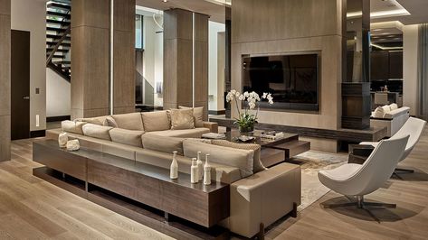 A living room designed by B+G Design features varying tones of wood accents and wood flooring by DuChâteau creates a modern, multitonal look. Barry Grossman Sectional Living Room Layout, Vegas House, Interior Design Living Room Modern, Miami Modern, Miami Living, G Design, Xxl Sofa, Florida Design, Design Room