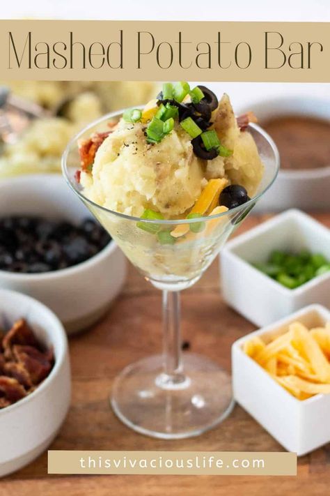 A mashed potato bar and a mashtini is the perfect hearty meal for a large crowd. It's easy to make and everyone loves creamy mashed potatoes combined with their favorite toppings. Martini Mashed Potato Bar, Potatoes For A Wedding, Mashed Potato Party, Mashed Potatoes Martini Bar, Mashed Potatoes Bar Wedding, Mashed Potato Bar Wedding Receptions, Mashed Potatoes Bar Ideas, Mashed Potato Bar Ideas Toppings, Mashed Potato Martini Bar