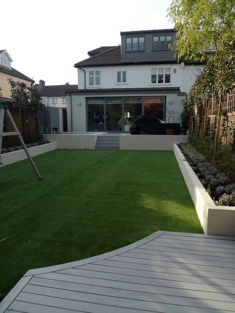 modern minimalist garden design low maintenance high impact garden design raised white wall beds grey decking east grass lawn turf sunken garden with fire and chimney flat trees balham wandsworth london (4) Grey Decking, Wandsworth London, Raised Garden Designs, Landscaping Modern, Lawn Turf, Raised Patio, Wall Beds, Garden Modern, Herb Garden Design