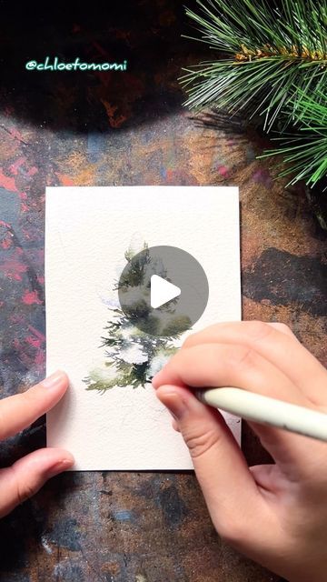 Chloe Tomomi on Instagram: "Snowy pine dream in watercolor 🌲❄️ Wet into wet approach for the snow and wet on dry for the foliage + charging in with deeper values and different temperatures. Letting them run into each other every now and then to give a more natural feel~ Got inspired by this approach by @theartsherpa on YouTube! Be sure to check her out! It feels awesome to add a new tool to one’s watercolor belt~ #chloetomomi #artreelsofinstagram #artreels #winterart #landscapeartist #watercolorpainting #watercolor" How To Sketch Pine Trees, Watercolor Snowy Trees, How To Watercolor Pine Trees, Watercolor Christmas Trees Tutorial, Winter Watercolor Paintings, Snowy Watercolor, Wet On Wet Watercolor, Trees Tutorial, Watercolor Pine Trees