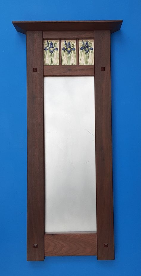 "Iris Tile Decorative Mirror in the Arts and Crafts Style.  This mirror features 3 hand made Iris tiles in a hand crafted Arts and Crafts frame.  The tile is hand painted.  The handmade frame comes in walnut or cherry.  The frame is 31\" tall X 11.5\" wide, the crown is 14.5\" wide X 3\" deep, the mirror measures 7\" X 21\". Allow 3-4 weeks for delivery, if all items are in stock , shipping time will be less. This piece will be a classic, heirloom to treasure in what ever home style you have.  I Arts And Crafts Style Decor, Craftsman Mirrors, Arts And Crafts Bedroom, Craftsman Style Interiors, Craftsman Frames, Craftsman Interior Design, Arts And Crafts Bathroom, Arts And Crafts Tiles, Craftsman Tile