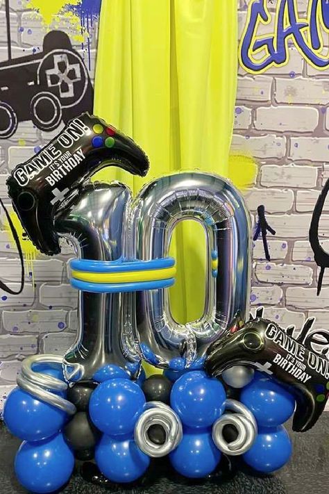 Check out this cool gamer-themed birthday party! The balloon decor is fab! See more party ideas and share yours at CatchMyParty.com Game Birthday Theme, Ps5 Birthday Party Ideas, Playstation Decoration Party, Playstation Birthday Theme, Gamer Balloon Decor, Playstation Birthday Party Ideas, Diy Gamer Birthday Decor, Gaming Balloon Garland, Gamer Party Ideas Boys