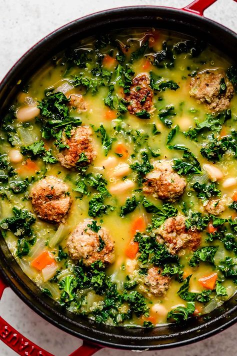 This Italian Wedding Soup with Turkey Meatballs is a flavor-forward & healthy twist on authentic Wedding Soup filled with tender turkey or chicken meatballs, gluten-free quinoa, hearty kale & cannellini beans, & lemon-infused broth. Serve with a spoonful of fresh pesto & savor each sip! Make-Ahead & Freezer-Friendly. Crock Pot / Slow Cooker & Instant Pot Directions Provided. #italianweddingsoup #italianweddingwithturkeymeatballs #healthysouprecipes #soupideas #dinnerideas #dinnerrecipes Kale And Meatball Soup, Turkey Meatball Soup Healthy, Turkey Kale Soup, Soup With Turkey Meatballs, Recipes With Turkey, Soup With Turkey, Soup With Meatballs, Beef And Pork Meatballs, Chicken Meatball Soup