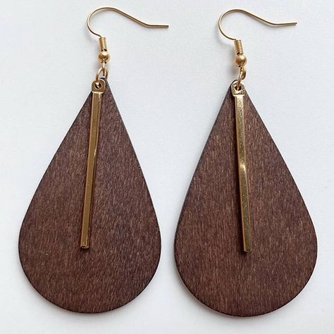 Metals Type: Zinc AlloyStyle: TRENDYFine or Fashion: FashionItem Type: EarringsEarring Type: Drop EarringsShape\pattern: EarringsMaterial: WoodGender: WomenSize: 7.50 cm - 9.00 cmWeight: 7 gType: Geometric Wood EarringsType1: Wooden Statement EarringsType2: Africa EarringsMaterials: Wood, Stone, Leather, Zinc Alloy . Our Handmade Zinc Alloy Geometric Wood Earrings are the perfect way to make a bold statement with your jewelry. These trendy African-inspired earrings feature a natural wooden desig African Inspired Earrings, Hammered Earrings, Jewelry Simple, Statement Drop Earrings, Jewelry Model, African Jewelry, Wood Earrings, Simple Jewelry, Simple Earrings