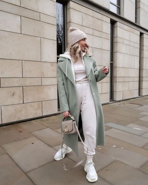 K A T I E P E A K E on Instagram: “These days I am always cosy casual 👟🍈🤍” Sage Coat Outfit, Sage Green Coat Outfit, Sage Trench Coat Outfit, Sage Green Trench Coat Outfit, Mint Green Colour Combinations, Mint Sweater Outfit, Knit Coat Outfit, Light Blue Coat Outfit, Wrap Coat Outfit