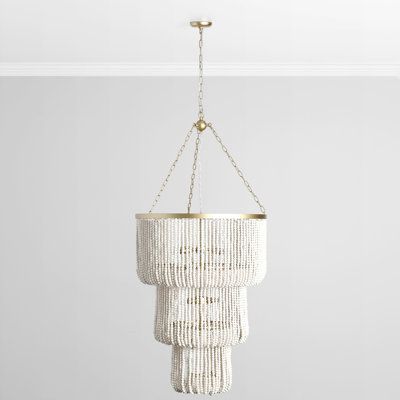 With artisanal wooden beads and a traditional three-tiered silhouette with a crisp, modern palette, this chandelier transcends any single style to create a breathtaking look that suits any design. | Bungalow Rose Fritsche 11 - Light Unique Tiered Chandelier in White / Yellow | 37.5 H x 28 W x 28 D in | Wayfair White Beaded Chandelier, White Bead Chandelier, Modern Palette, Tiered Chandelier, Construction Crafts, White Chandelier, Classic Home, Beaded Chandelier, Candelabra Bulbs