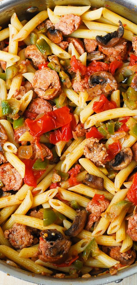 Italian Sausage Pasta with Vegetables. Italian sausage is seared with bell peppers, mushrooms, onions, fresh tomatoes in cajun spices, with a splash of red wine! Topped with freshly grated Parmesan cheese! Pasta With Vegetables, Italian Salad Recipes, Sausage Peppers And Onions, Sausage Dinner, Sausage Pasta Recipes, Pasta With Sausage, Sausage Peppers, Italian Sausage Pasta, Italian Sausage Recipes