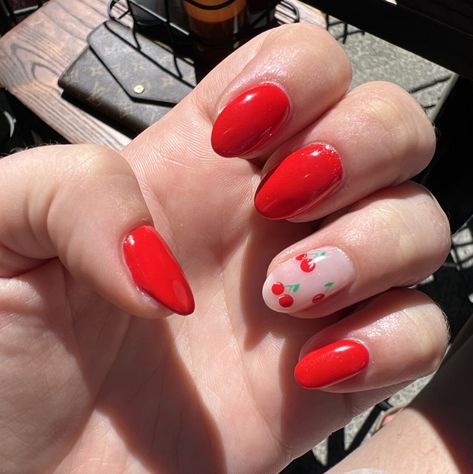 Almond tipped hot bright red manicured nails with cherry accent. Cherry Accent Nail, Bright Cherry Red Nails, Red Nails With Cherries, Cherry Nails Almond, Bright Red Nails With Design, Cherry Almond Nails, 2023 Red Nails, Cherry Nail Designs, Red Cherry Nails