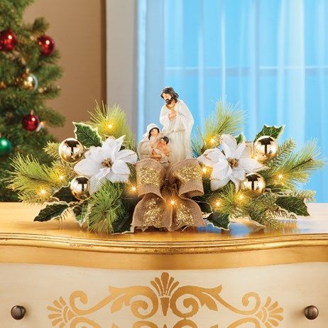 White & Gold Lighted Nativity Floral Centerpiece | Collections Etc. Xmas Windows, Poinsettia Centerpiece, Storing Christmas Decorations, Sparkling Lights, Floral Centerpiece, Christmas Nativity Scene, Christmas Poinsettia, Collections Etc, Gold Ornaments