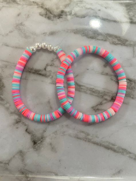 This adorable bracelet set based off of mermaid bubbles! It is super stretchy, durable, and very affordable! Cute Bracelet Ideas Diy, Small Bracelet Business, Cute Clay Bead Bracelets, Bracelet Buisness, Preppy Clay Bead Bracelets, Bracelet Names, Clay Bead Bracelet Set, Diy Bracelet Ideas, Mermaid Bubbles