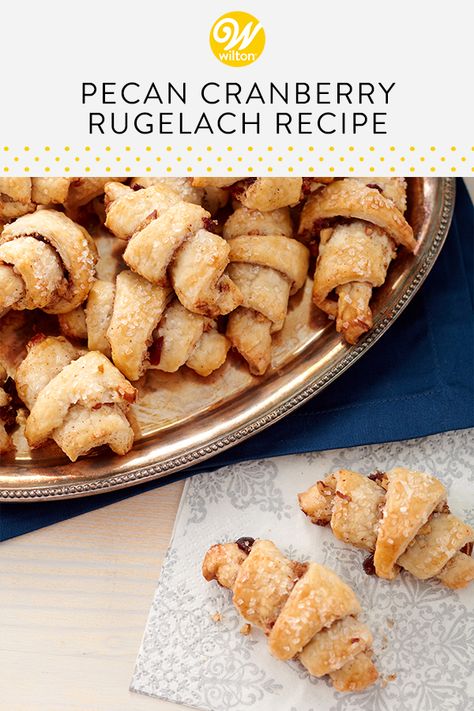 Rugelach is a beloved Jewish pastry whose Yiddish name can roughly translate to “little twists.” These cute, crescent-shaped desserts are usually made with sour cream or cream cheese doughs and can be filled with whatever fruits and nuts you like. Our version includes the tasty crunch of pecans and the tartness of cranberries for a truly dynamic flavor. #wiltoncakes #recipes #baking #fruit #nuts #cranberryrecipes #pecanrecipes #jewishrecipes #bakingideas #holidaybaking #flavor #ideas #howto Rugelach Recipe, Nut Rolls, Puff Pastries, Cookie Recipes Homemade, Recipes Baking, Communion Cakes, Homemade Cake, British Baking, Pecan Recipes