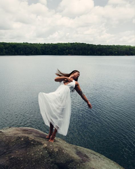 Girl falling into lake in long dress Falling Into Water Photography, Person Falling Off Cliff, Girl Falling Off Cliff, Falling Photoshoot, Falling Photography, Falling Off A Cliff, White Dress Fall, Grad Shoot, Person Falling